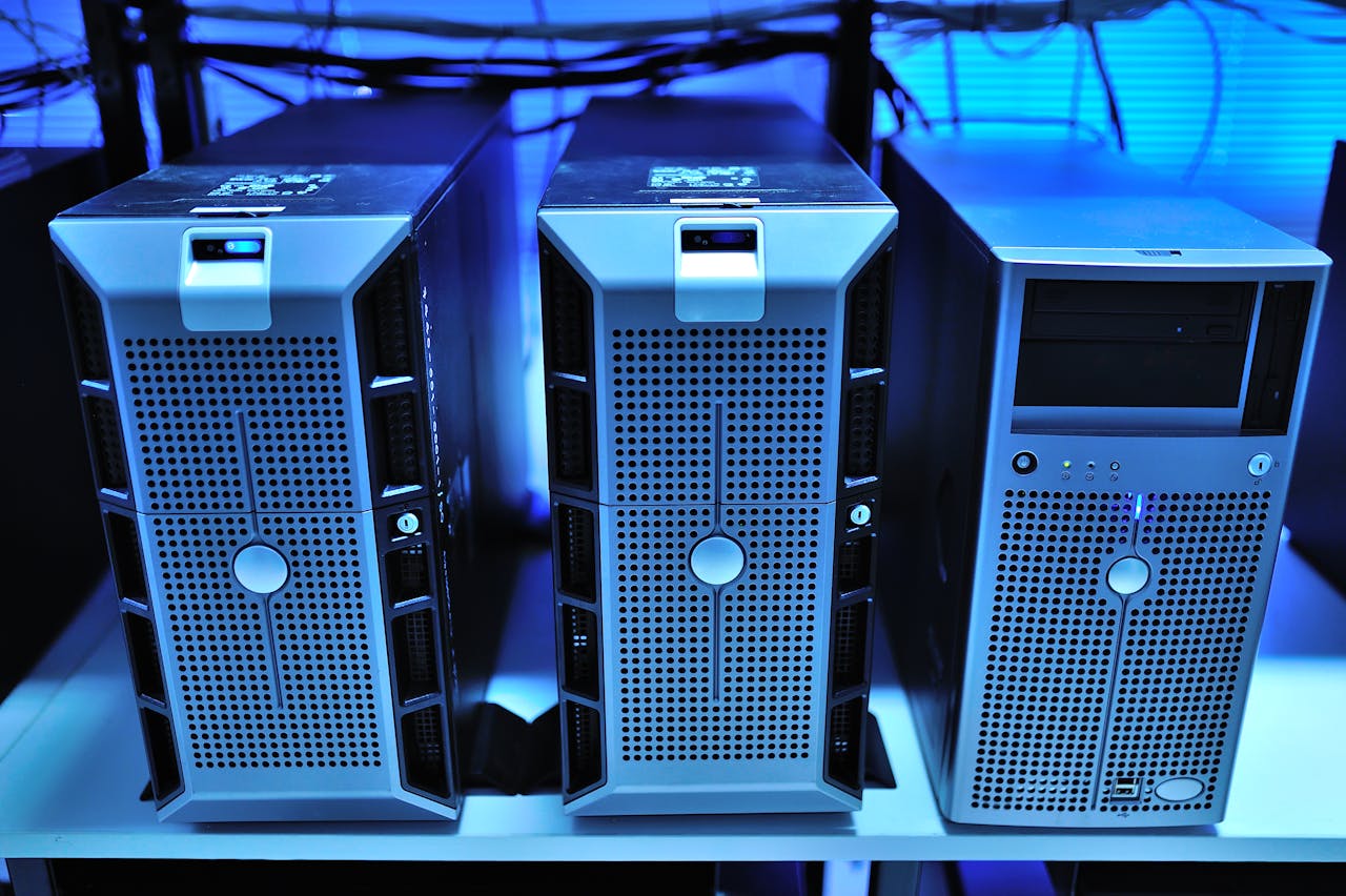 hero-img Close-up view of modern rack-mounted server units in a data center.